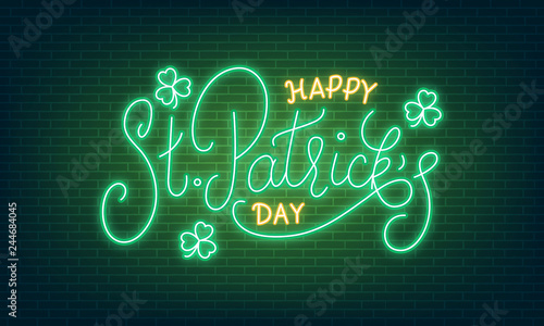 Patricks Day. Neon glowing lettering sign of Happy St. Patrick's Day lettering and clover leaves.