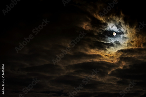 Night sky with full moon and beautiful clouds.