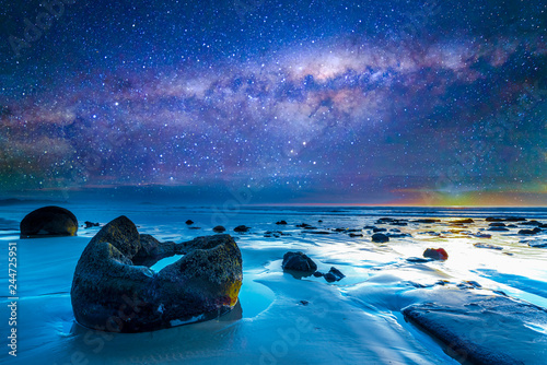 Milky way at boulder moeraki, new zealand.