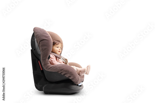 Baby girl strapped in a car seat