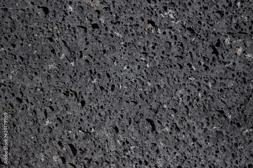 basalt wall, volcanic rock, stone with holes