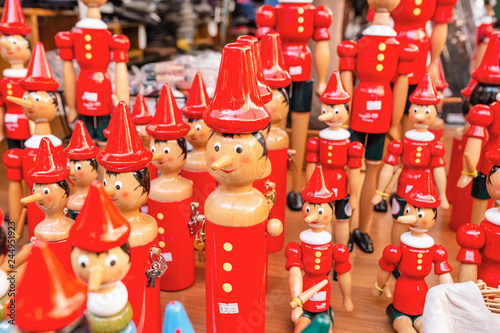  pinocchio puppets toys for sale at touristic shop as souvenirs from Italy