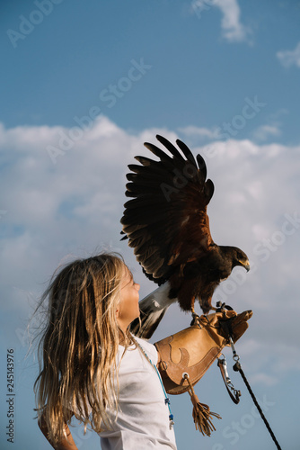 Little Girl with the bird rapacious in her hand