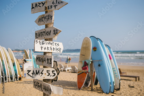 surfing on the beach, weligama sri lanka