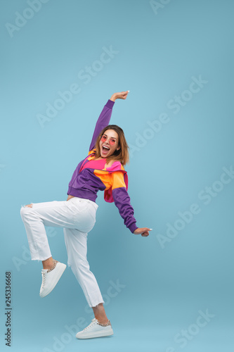 Excited stylish woman looking at camera