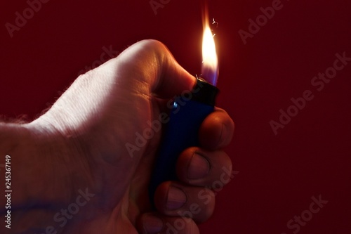 lighter in the hand of an arsonist