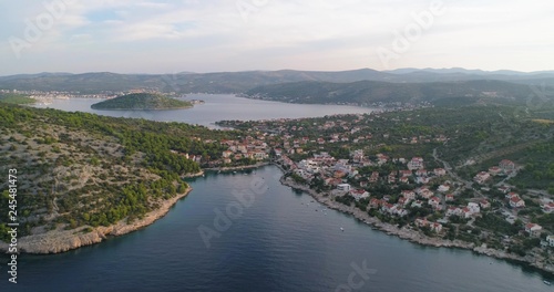 Mediterranean town, C4k aerial, tracking, drone shot, of the Razanj village, on the croatian coast and the turquoise, adriatic sea, on a sunny, summer morning, in Croatia