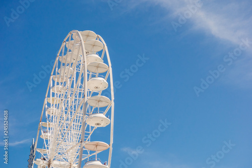 White big wheel against blue sky, copy space
