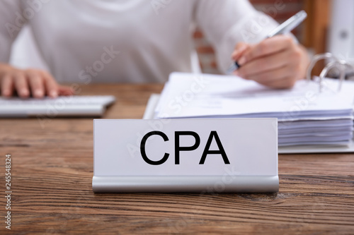 CPA Name Plate On The Table In The Office