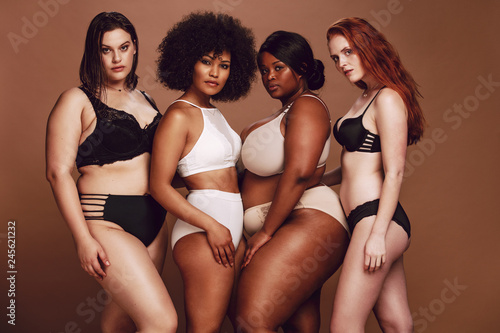 Proud group of women in lingerie posing together