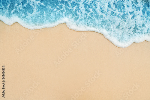 Background of Soft Blue Ocean Wave On Sandy Tropical Beach.