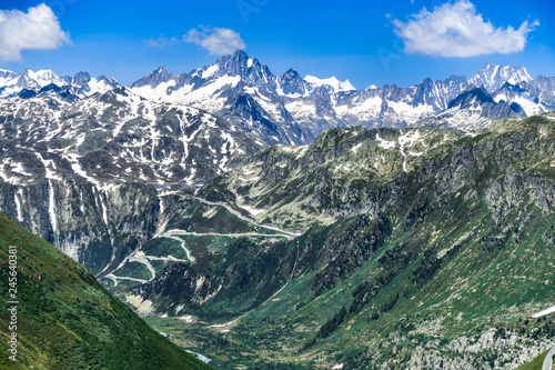 Serpentine road of the Grimsel pass (2.164 m) in a beautiful sunny alpine scenery, Valais, Switzerland