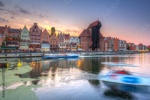 Old town of Gdansk reflected in Motlawa river at sunset, Poland