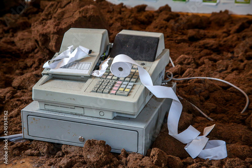 Old cash register with cash register tape.