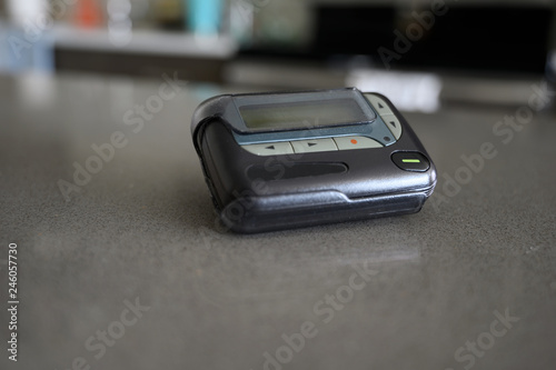 Artistic View of Doctor's Pager on Nursing Desk