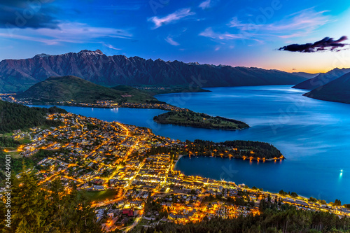 New Zealand. South Island, Otago region. Queenstown and Lake Wakatipu by night, the Remarkables mountain range behind