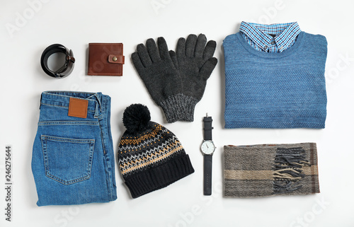 Flat lay composition with male winter clothes on white background