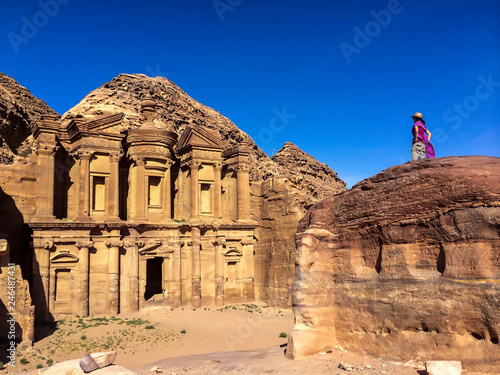 Traveler admiring the grandness of The Monastery in Petra Jordan