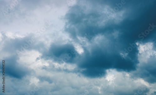 Stormy cloud on grey sky. Cloudscape photo background. Moody skyscape with rain cloud. Stormy cloudiness banner template