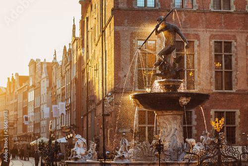 Poland, Gdansk, Famous Neptune fountain at sunset . Famous travel destination in Europe