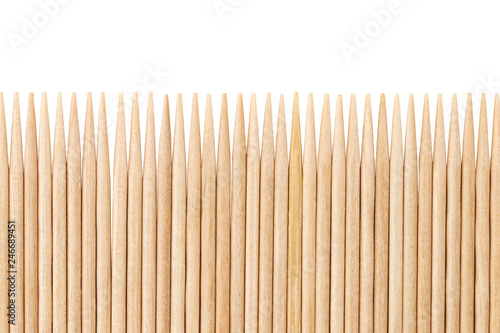 Bamboo toothpicks are placed in parallel - backgrounds, textures. Bamboo toothpicks isolated on white background