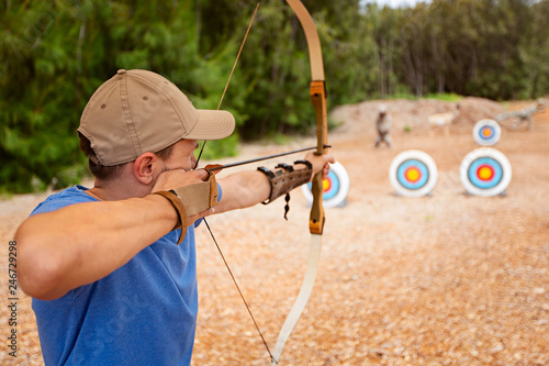 man practicing archery