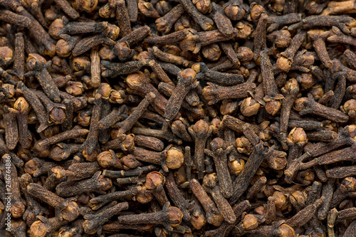 Freshly dryed clove spice texture close up. Top view.