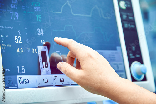 Monitoring patient's vital sign in operating room. doctor cheking at patient's vital signs. Cardiogram monitor during surgery in operation room.