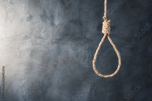 the noose against grunge wall background, failure or commit suicide concept