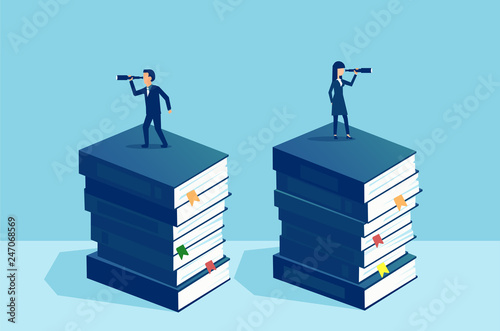 Businessman and businesswoman standing on pile of books looking at future in opposite direction