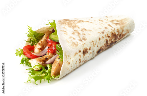 Tortilla wrap with fried chicken meat and vegetables