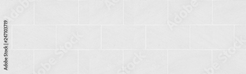 Panorama of white tile wall pattern and seamless background