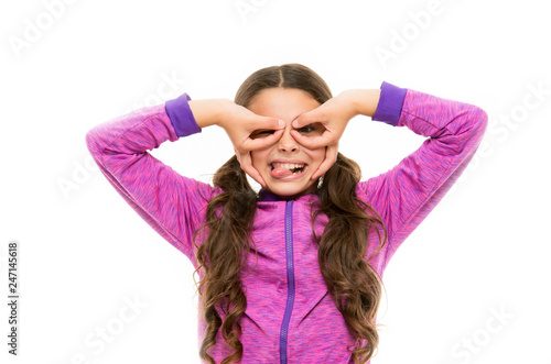 Cheerful grimace. Girl holding fingers like glasses mask superhero or owl. Play game with mask superhero. Child cheerful mood grimace with mask. Pretend be fantastic hero. Kid hide face finger mask