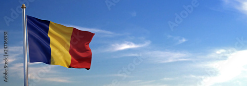 Flag of Romania rise waving to the wind with sky in the background