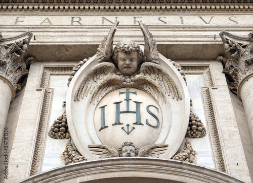 Christogram IHS, facade of the Church of the Gesu, mother church of the Society of Jesus, Rome, Italy 