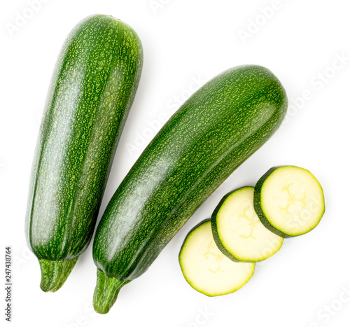 Ripe zucchini and sliced slices on a white. The form of the top.
