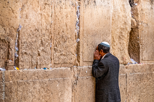 Believing Jew is praying near the wall of crying