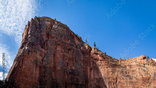 the cliff face of zion national park on a clear crisp blue autumn day