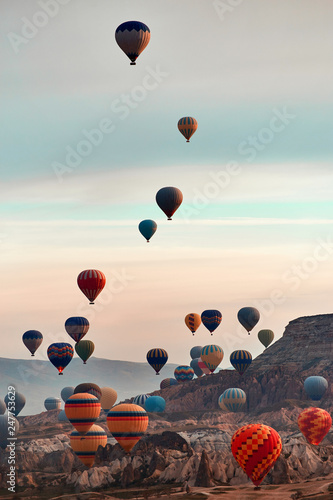 Mountain landscape with large balloons in a short summer season at dawn.