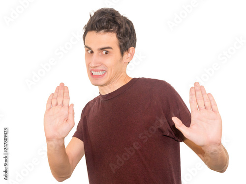 Portrait disgusted young man. Negative human emotion. Isolated on a white background.