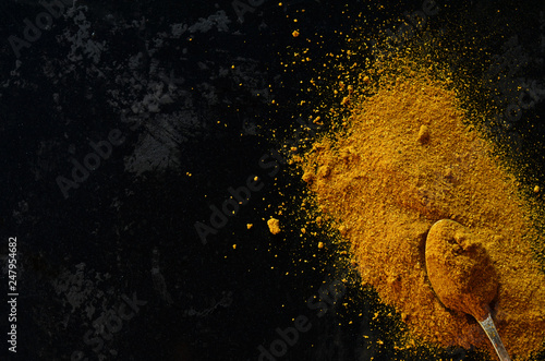 Garam masala powder on a black background