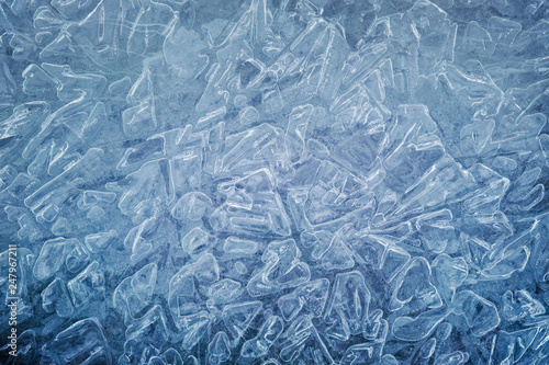 Ice natural textured blue background close up