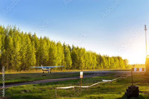 Light passenger planes parked before departure at private airport in Kronshtadt, St.Petersburg, Russia. Industrial and civil air transportation by aircraft. Professional flights on airplanes