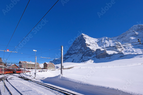 Jungfrau railway train station at Kleine Scheidegg to Jungfraujoch, north face of mount Eiger in background, Switzerland