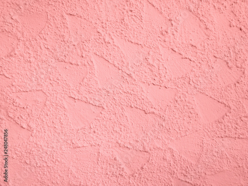 Rosa strukturierte Wand einer Hausmauer