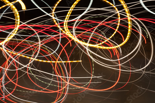 Abstract blurred colorful light effect on a black background. Long exposure photo of moving camera