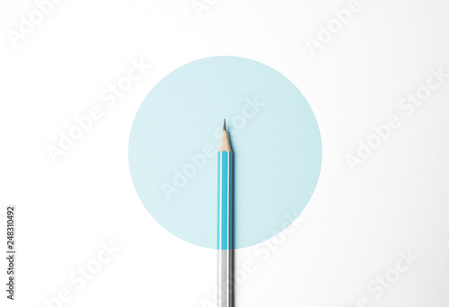 Blue pencil on white background, minimalism. Creativity, idea, solution, creativity concept.