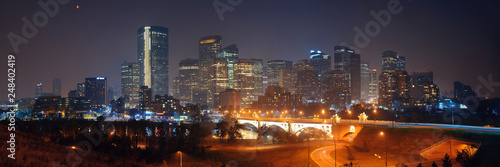 Calgary downtown cityscape with skyscraper and bridge at night, Canada.