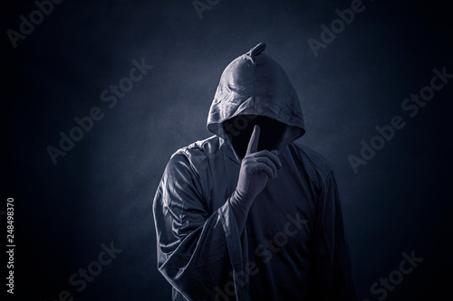 Scary figure in hooded cloak