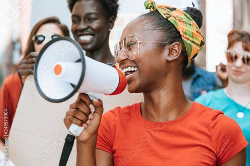 Smiling demonstrator with megaphone